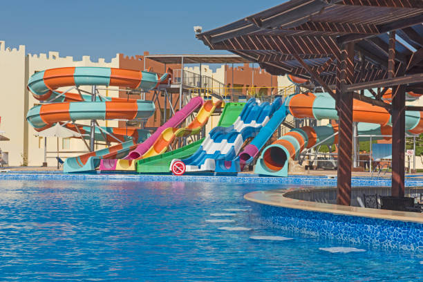 istock Swimming pool with bar in a luxury tropical hotel resort 873657774