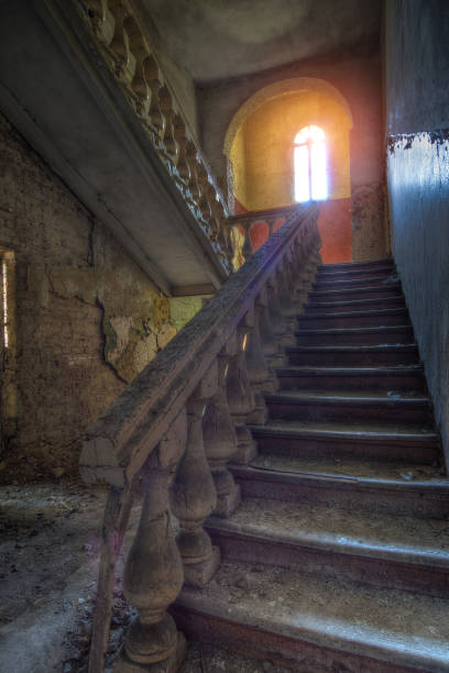istock Old vintage staircase in abandoned mansion 873663834
