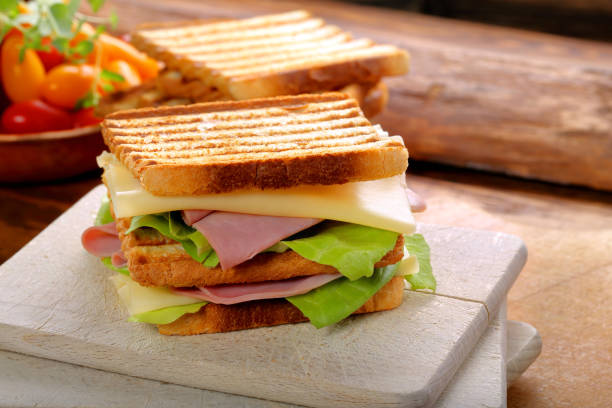 istock Fresh sandwiches with ham and cheese 873669676