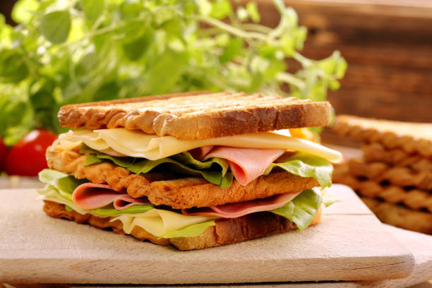 istock Fresh sandwiches with ham and cheese 873669758