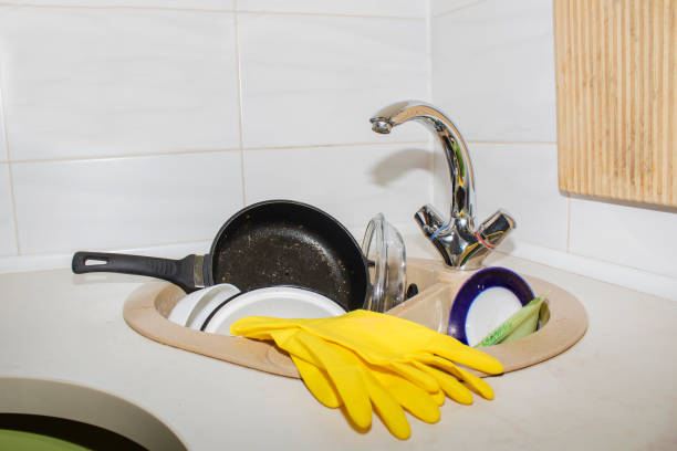 huge heap of dirty dishes waiting for the flatmate huge heap of dirty dishes waiting for the flatmate. flatmate stock pictures, royalty-free photos & images