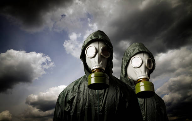 istock Two gas masks and dramatic sky. Survival concept. 873669836