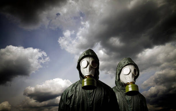 istock Two gas masks and dramatic sky. Survival concept. 873669838