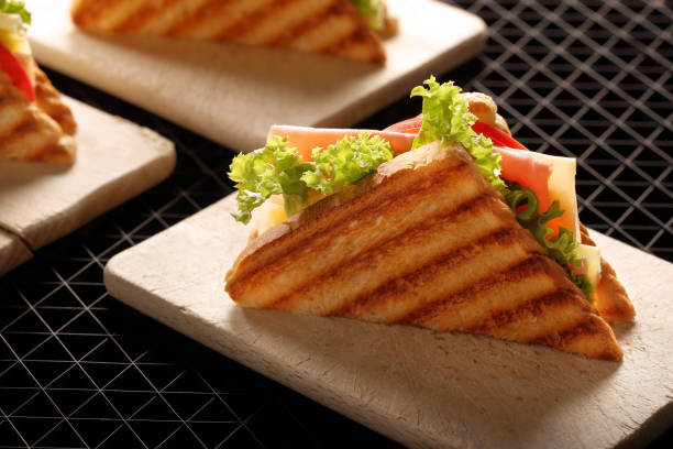 istock Fresh sandwiches with ham and cheese 873670080