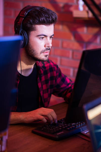 istock Pleasant bearded man is enjoying his hobby 873674172