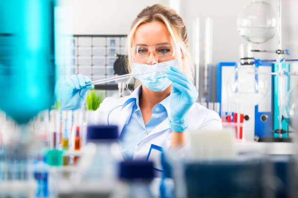 istock Young attractive female scientist preparing laboratory equipment for tests 873679688