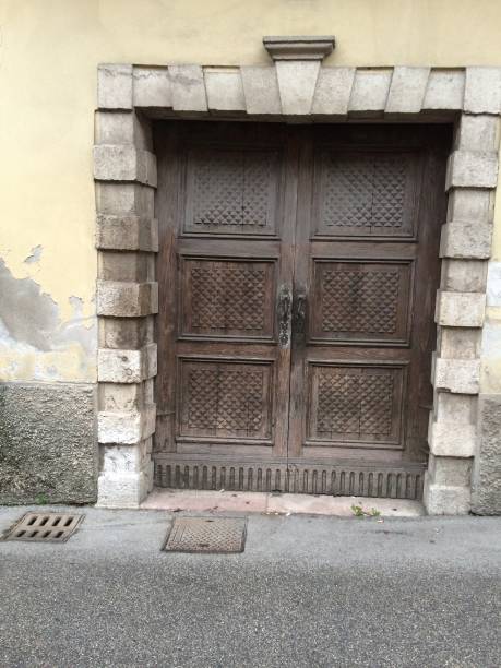 istock Old wooden door in Marostica 873681076