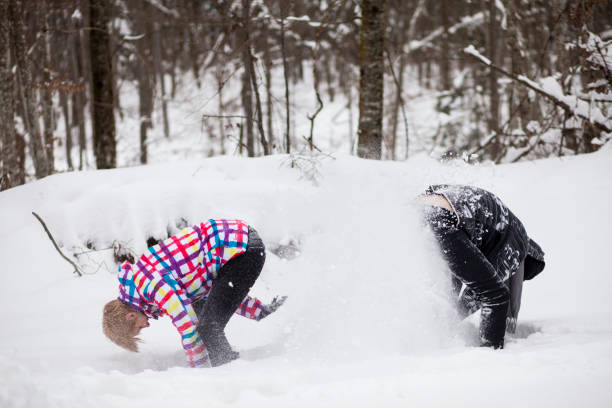 istock Young couple having fun in snow 873684858