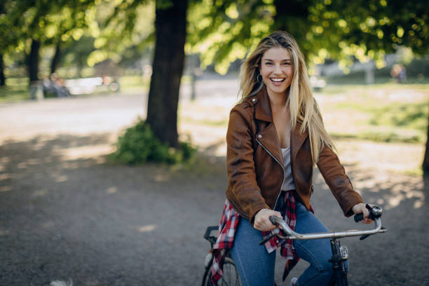 istock Hipster girl on bike 873684872