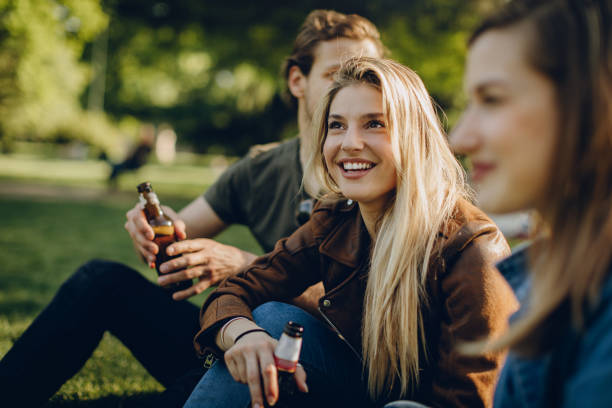 istock Friends enjoying outdoors with the beer 873691320