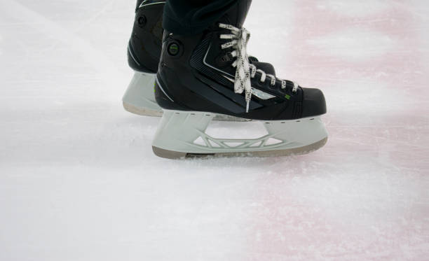 istock Hockey skates on rink 873699412