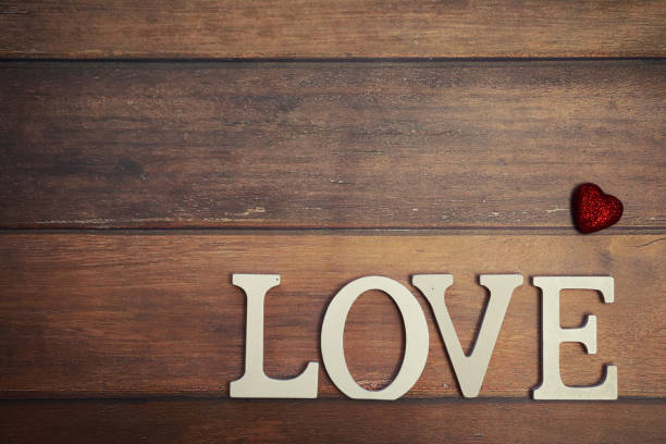 istock word Love from wooden letters on background 873702256