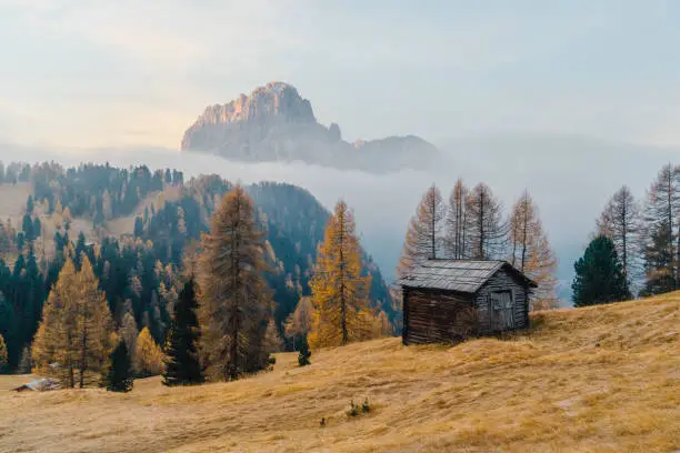 Small scenic village in Dolomites mountains in  Italy at sunrise