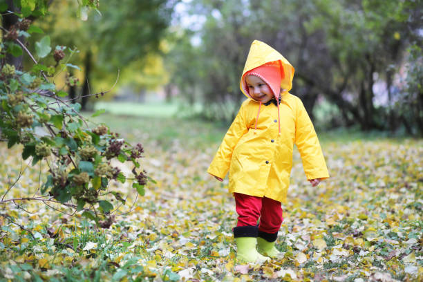 istock Children in the autumn park walk 873705850