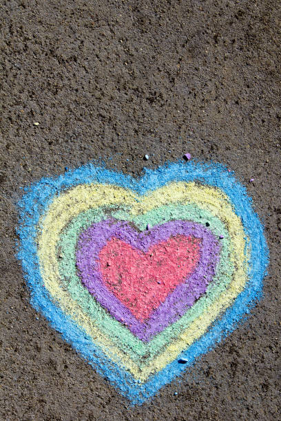 istock chalk drawing: colorful hearts on asphalt 873706158