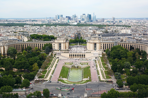 A view of Paris city from the Eiffel Tower with Palais de Chaillot  and other buildings and streets with green trees in May 2017