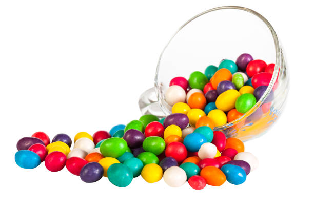 istock colorful  sprinkle candies in a glass isolated on a white background 873718562