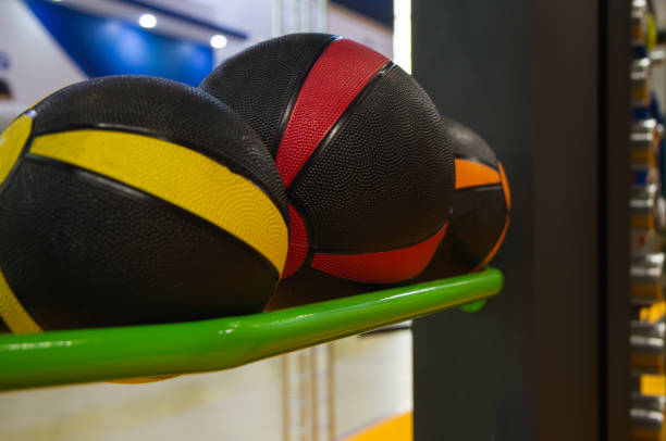 istock several colored basketballs lying on the shelf in the gym for workouts 873718848