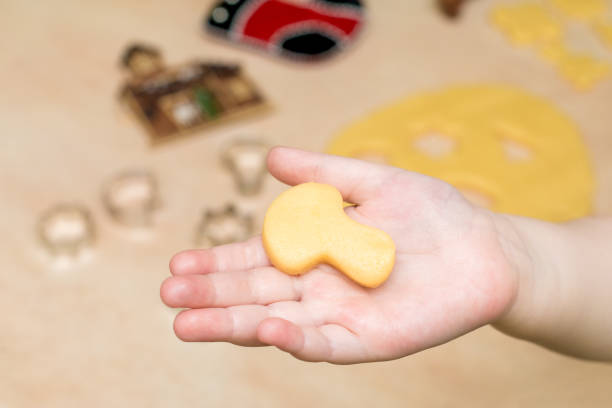 istock Children's hands make christmas cookies 873721872