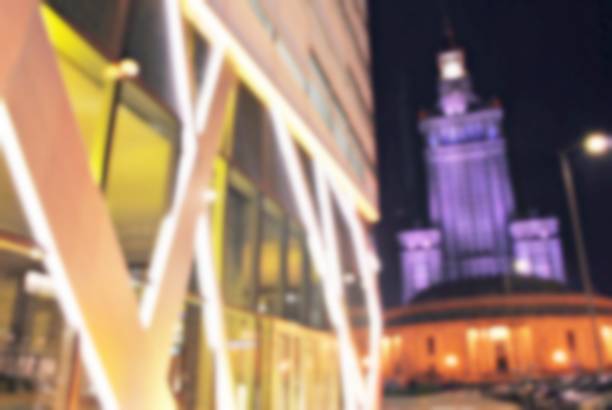 istock Blurred night architecture skyscrapers with glass facade. Modern buildings 873730100