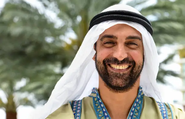 Smiling middle eastern man looking at the camera