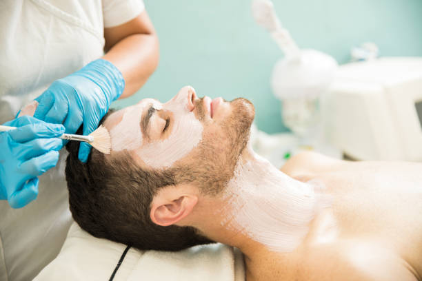 istock Man getting a facial treatment 873733078