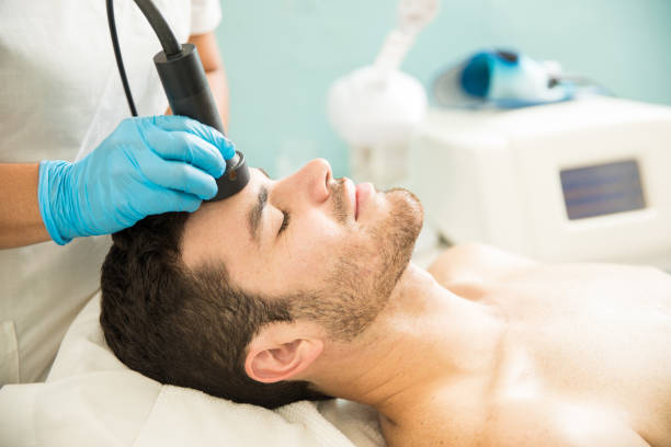 istock Man getting a radiofrequency facial 873733330