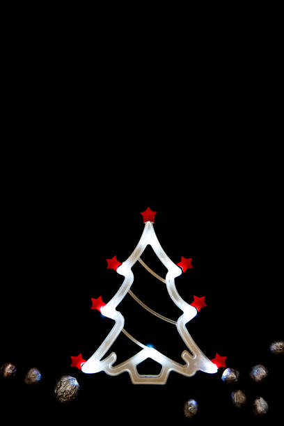 istock Christmas tree shaped led light tube on black 873746268
