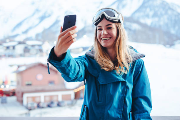istock young  snowboarder woman 873746384