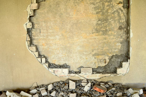istock Partially destroyed wall inside an industrial building under demolition 873747270