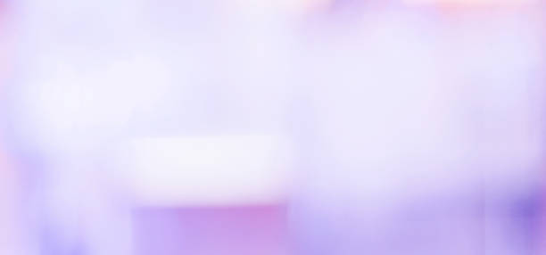 istock Blurred background, purple festive light abstract bokeh background, banner 873751050