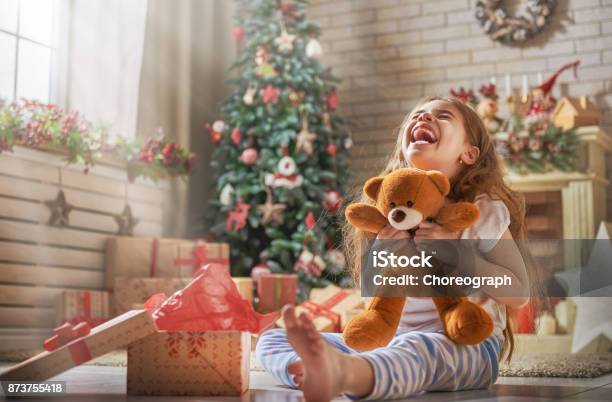 Child Opening Present Stock Photo - Download Image Now - Child, Christmas, Christmas Present