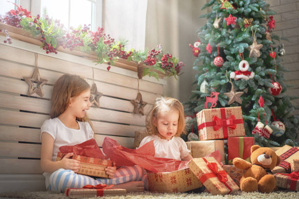 istock girls opening gifts 873755482