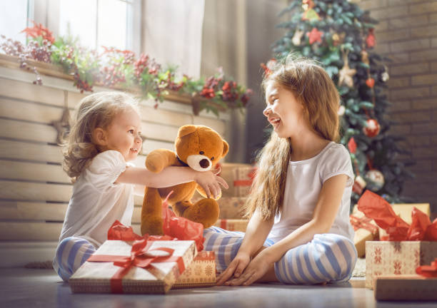 istock girls opening gifts 873755484