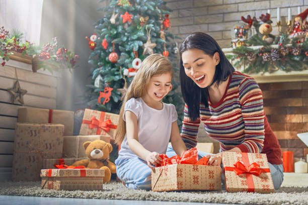 istock Mother and daughter exchanging gifts 873755494