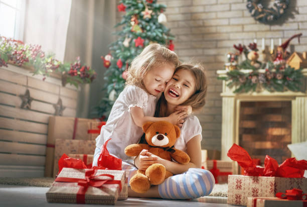 istock girls opening gifts 873755496