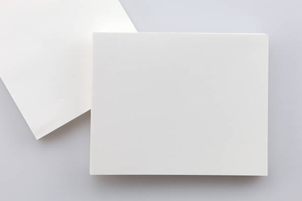 istock business white paper card on white background. 873758136