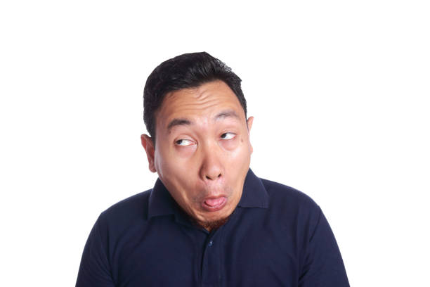 Funny Asian man chocked with tongue out isolated on white