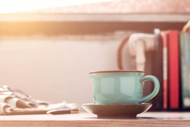 istock Cup of coffee on desk. 873768820