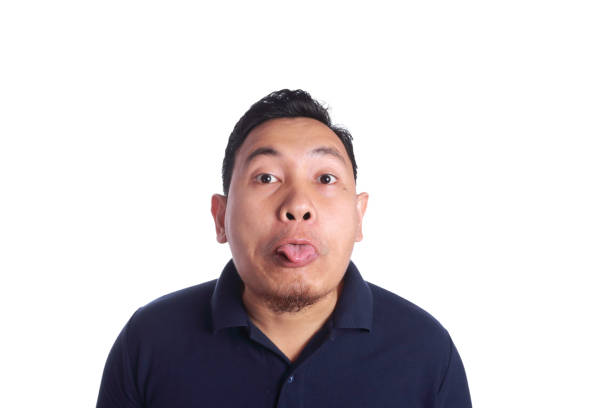 istock Asian Man Mocking with Tongue Out 873769276