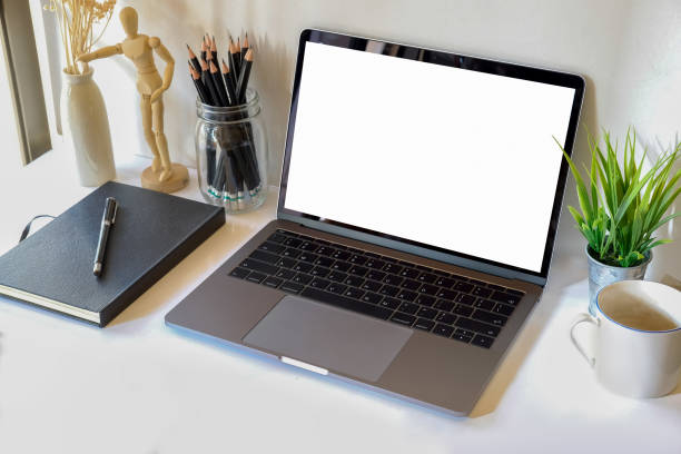 istock Mock up : Workspace white wood desk with blank screen labtop, book and coffee. copy space for products or graphic montage. 873775222