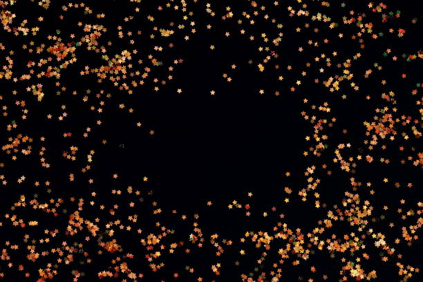 istock Abstract of golden glitter frame on a black background 873775324