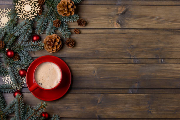 istock Red cup with coffee and Christmas decoration 873776170