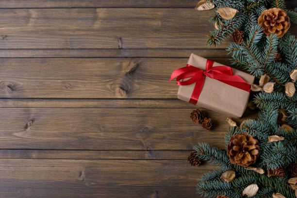 istock Christmas background with fir and cones tree and gift box 873776316