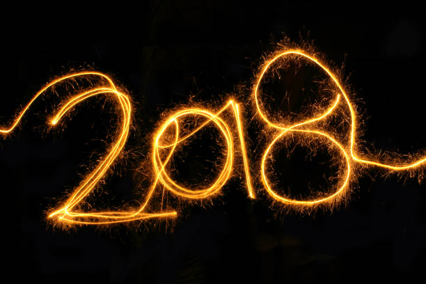 istock New Year 2018 sparkler on a black background 873780588