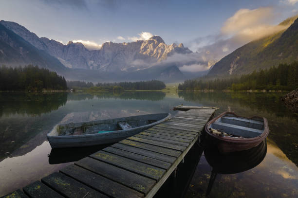 istock wooden bridge over a mountain lake 873780826