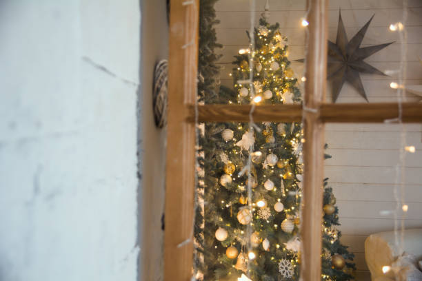 istock Christmas spruce through door frame in room 873790610