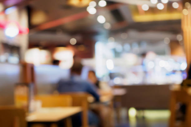 istock Blur customers in cafe restaurant or coffee shop abstract background with bokeh light 873794436
