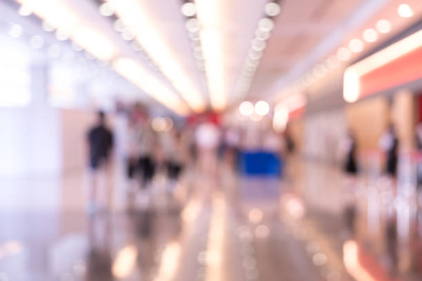 istock Blurred exhibition event in hall with many people on background 873795046