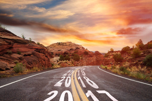 istock Year 2017 changing to 2018 - country road 873798810